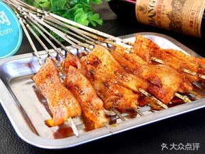 Small Skewer Grilled Meat and Paper-Wrapped Fish