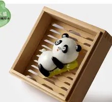 Panda Holding Bamboo Dumplings