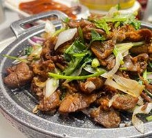 Beijing-style grilled lamb on a hot iron