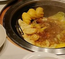 Stewed Rooster in Iron Pot