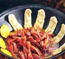 Stewed Pork Ribs and Chicken Feet in Iron Pot
