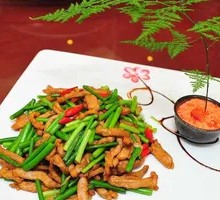 Stir-fried shredded pork with garlic shoots