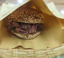 Pork-filled flatbread sandwich