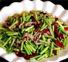 Stir-fried shredded pork with garlic shoots