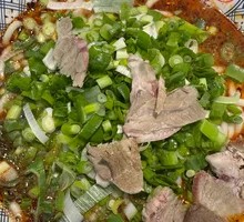 Hand-extruded noodle soup