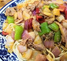 Onion Stir-Fry with Pork over Noodles