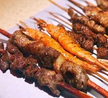 Lamb Leg Skewers on Red Willow Wood