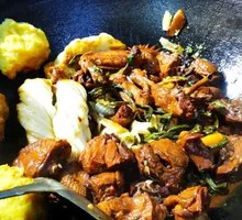 Stewed Rooster in Iron Pot