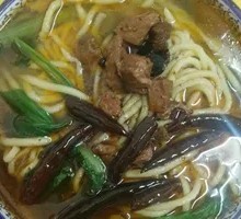 Hand-extruded noodle soup