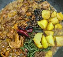 Stewed Chicken and Pork Ribs in Iron Pot