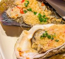 Steamed Scallops, Mussels, and Oysters with Garlic Noodles