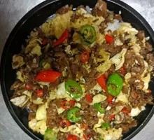 Grandmother's Vegetable Stir-Fry with Egg in Wooden Bowl Rice