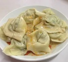 Chinese Herb and Pork Dumplings with Peanut Sauce
