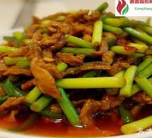 Stir-fried shredded pork with garlic shoots