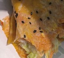 Double Egg Bacon and Sesame Seed Pancake